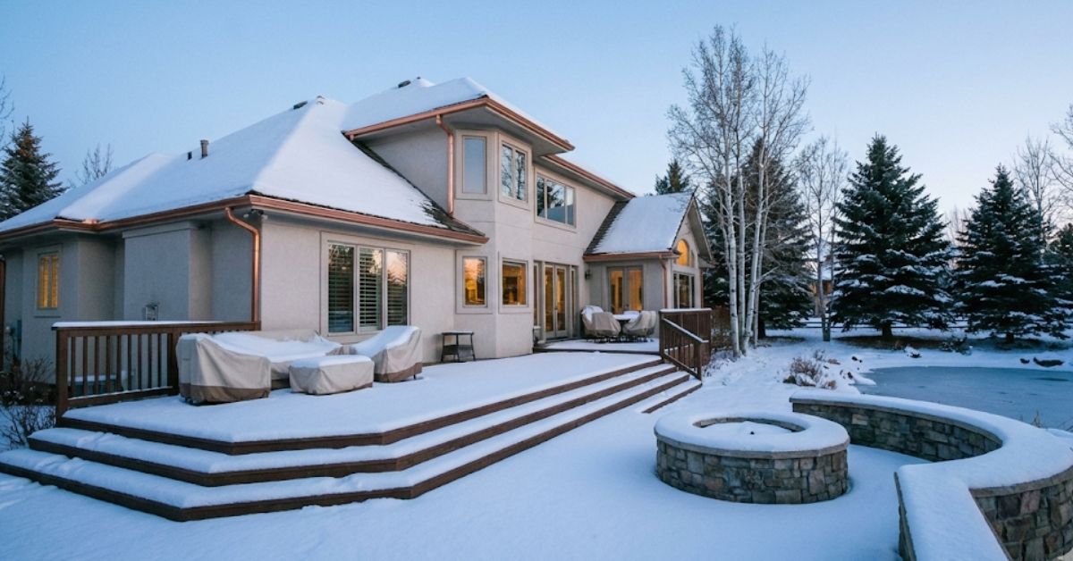 A winter backyard inspection showing a well-maintained home exterior in 2026