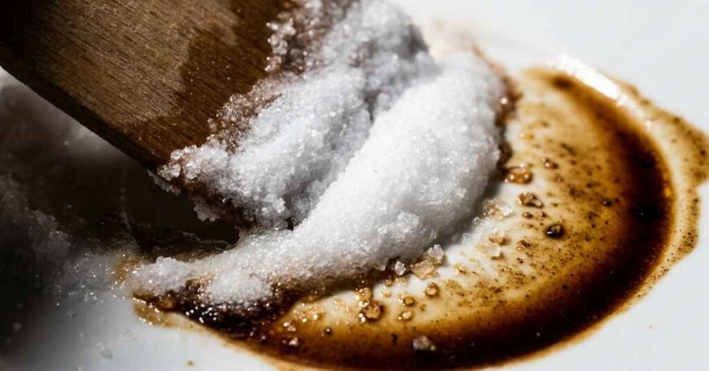Why I Threw Away My Bleach and Used This $2 Pantry Item to Erase Coffee Stains 2 Macro shot of baking soda paste lifting a dark coffee stain.